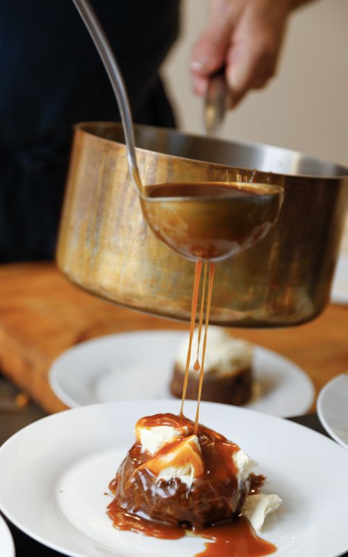 Homemade caramel sauce over chocolate lava cake